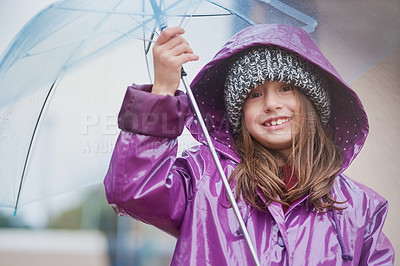 Buy stock photo Portrait of a little girl standing under an umbrella outside