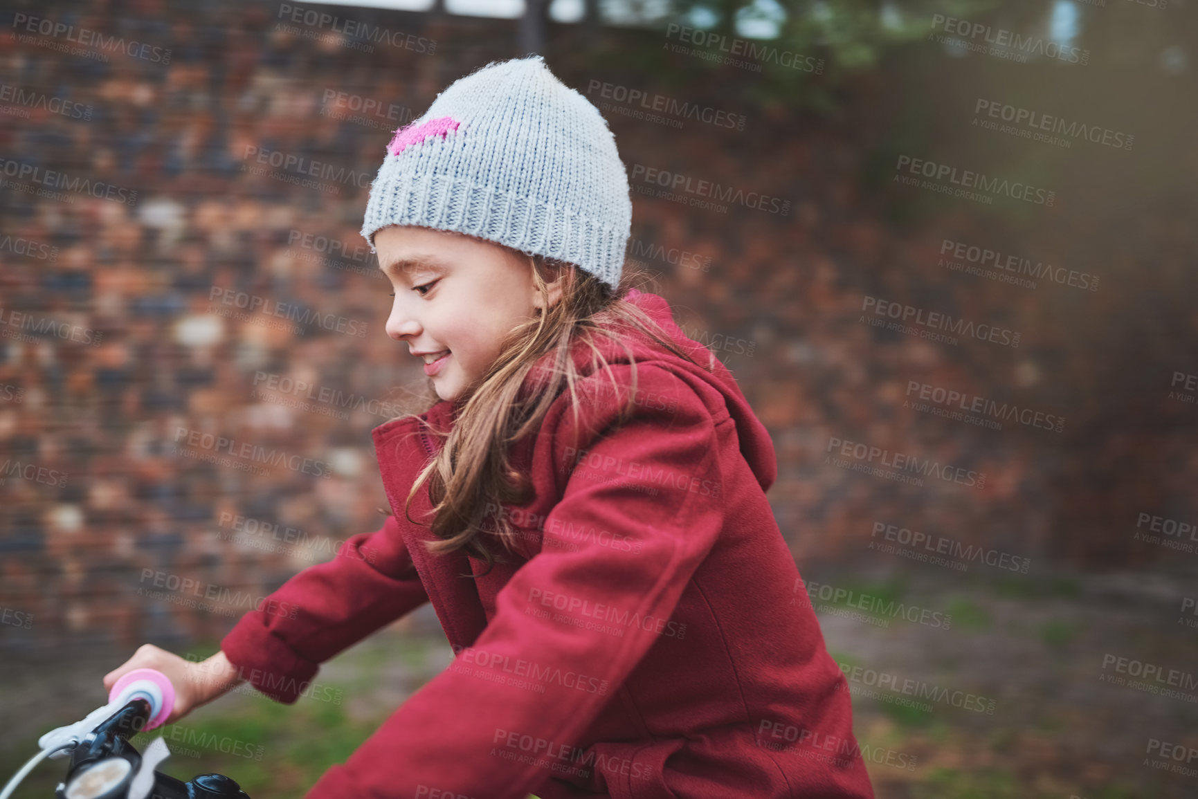 Buy stock photo Little girl, riding and neighborhood with bicycle for learning, hobby or outdoor activity. Female person, child or kid cycling with bike for playful adventure, journey or trip at park or backyard