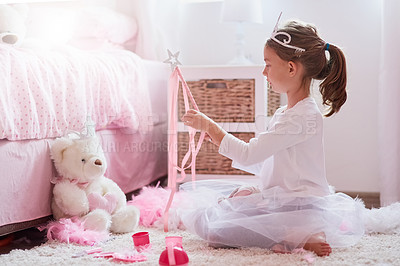 Buy stock photo Shot of a little girl dressed up as a princess while playing make believe