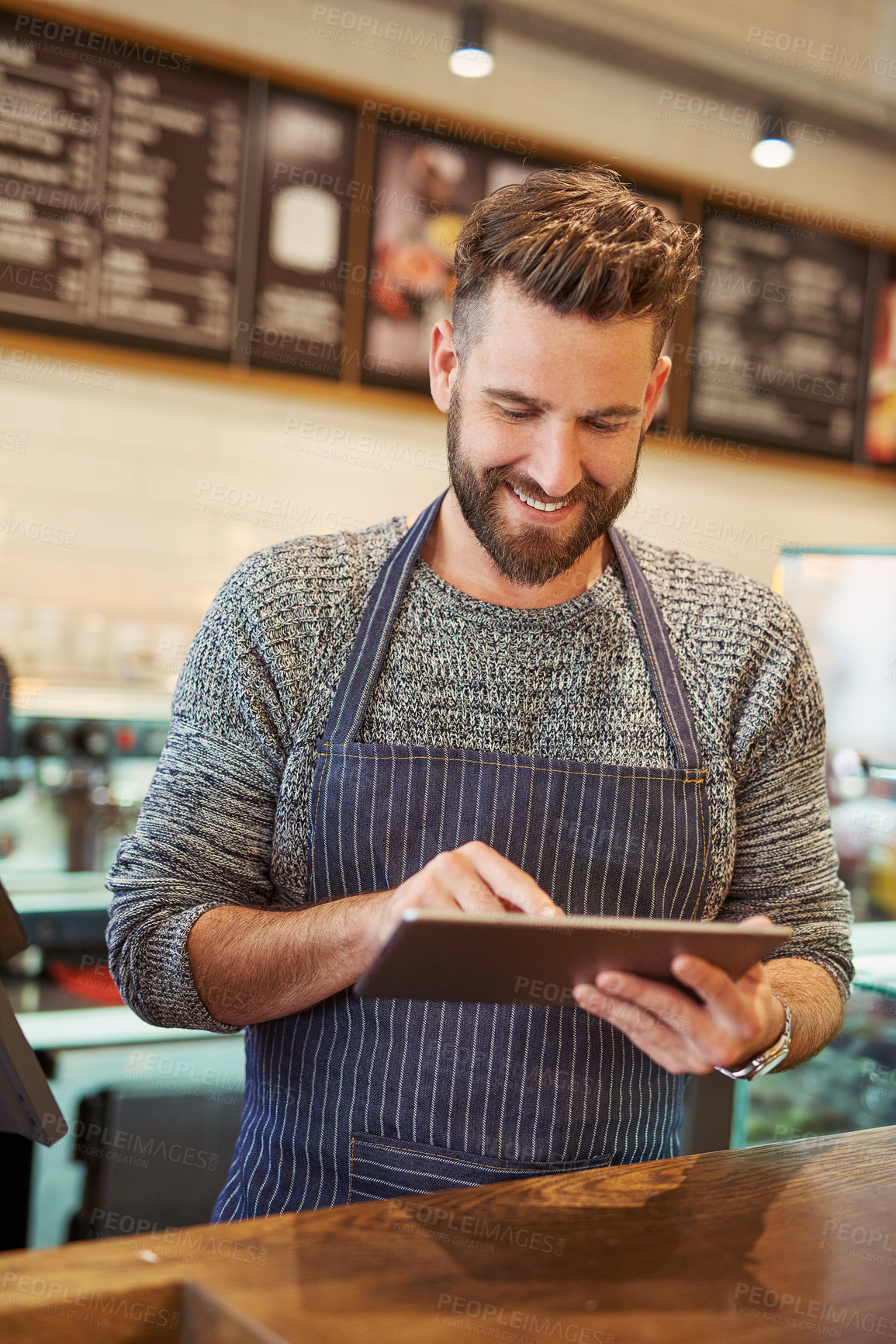 Buy stock photo Happy, man and barista with tablet in cafe for restaurant sales, discounts and reviews on website online for management. Smile, owner and digital technology for e commerce, check list and menu update