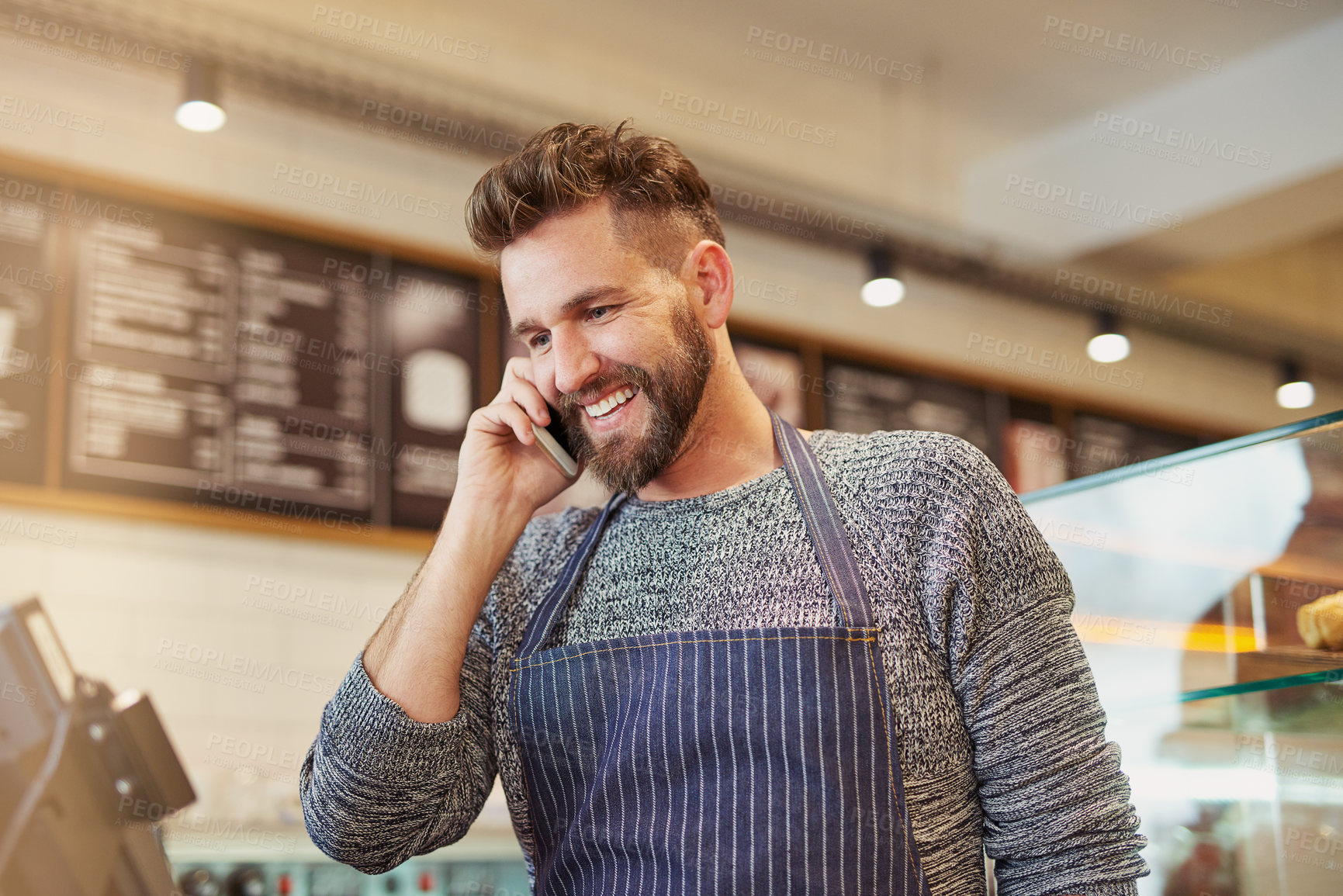 Buy stock photo Happy, man and barista with phone in cafe or restaurant for communication on online order, sales and discounts. Smile, owner and contact with customer for e commerce, check list and menu update