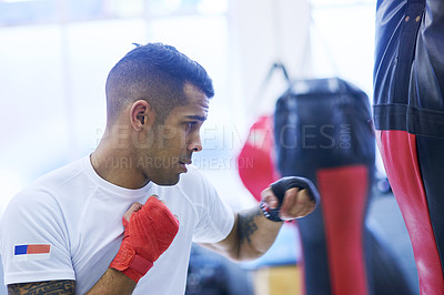 Buy stock photo Gym, boxer or man punching bag for workout, exercising and training for competition. Professional, boxing and male athlete in ring ready with energy, commitment and mma fighter as sports or hobby