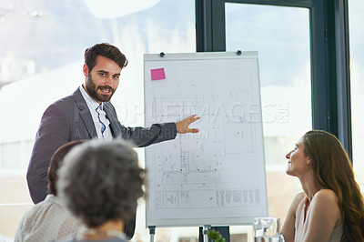 Buy stock photo Shot of a team of professionals having a meeting at work