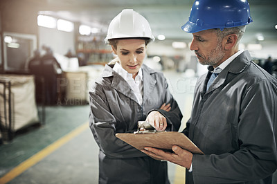 Buy stock photo Man, woman and checklist with clipboard in factory for quality inspection or safety checks and process monitoring. Team, communication and board for manufacturing information in printing warehouse.