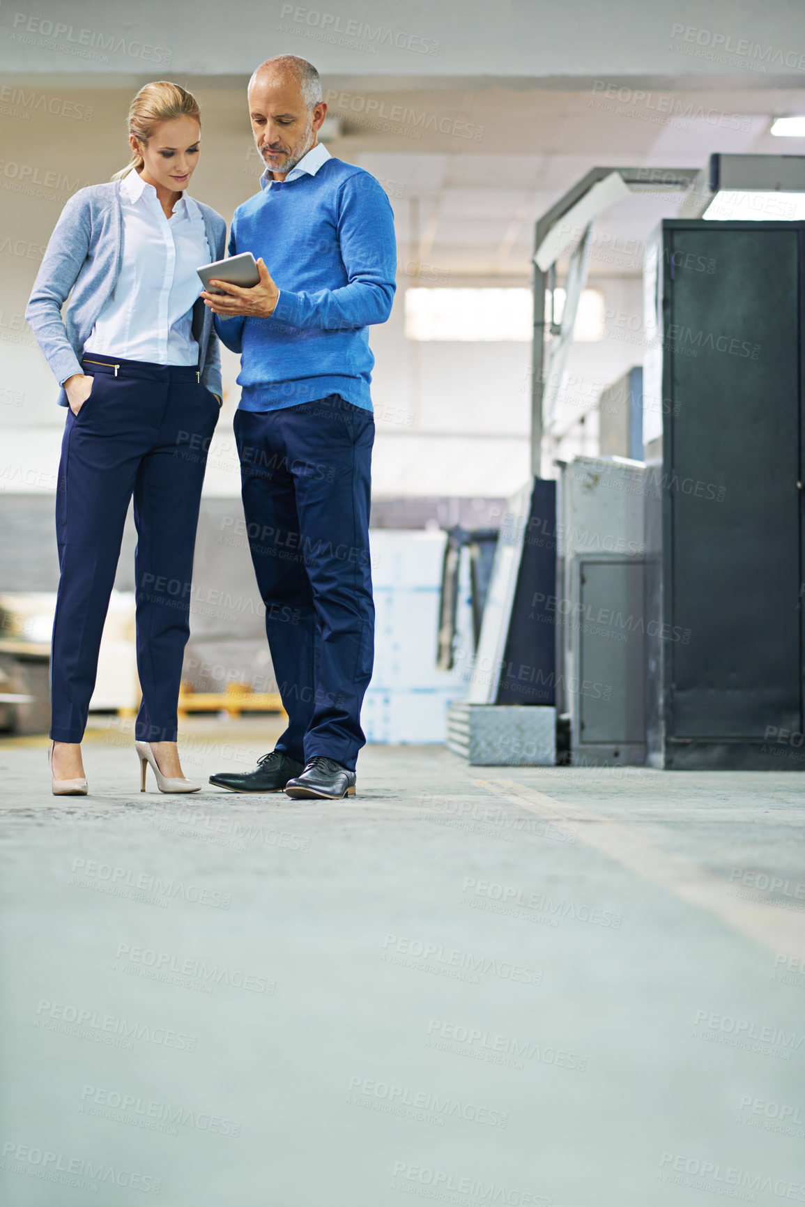 Buy stock photo Senior, man and woman with tablet in warehouse for production monitoring, inventory or order management and inspection. Team, digital tech and factory for printing material and distribution industry.