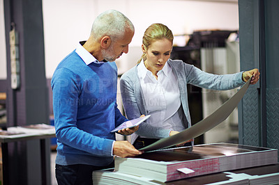 Buy stock photo Printing industry, tablet and people with paper for communication in creative sector, warehouse and factory for design project. Teamwork, man and woman talking, technology and quality check of work