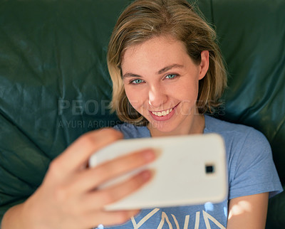 Buy stock photo Top view, happy woman and selfie on sofa in home for social media, memory and online post. Photography, smile and face of girl in profile picture above, relax or influencer on internet in living room