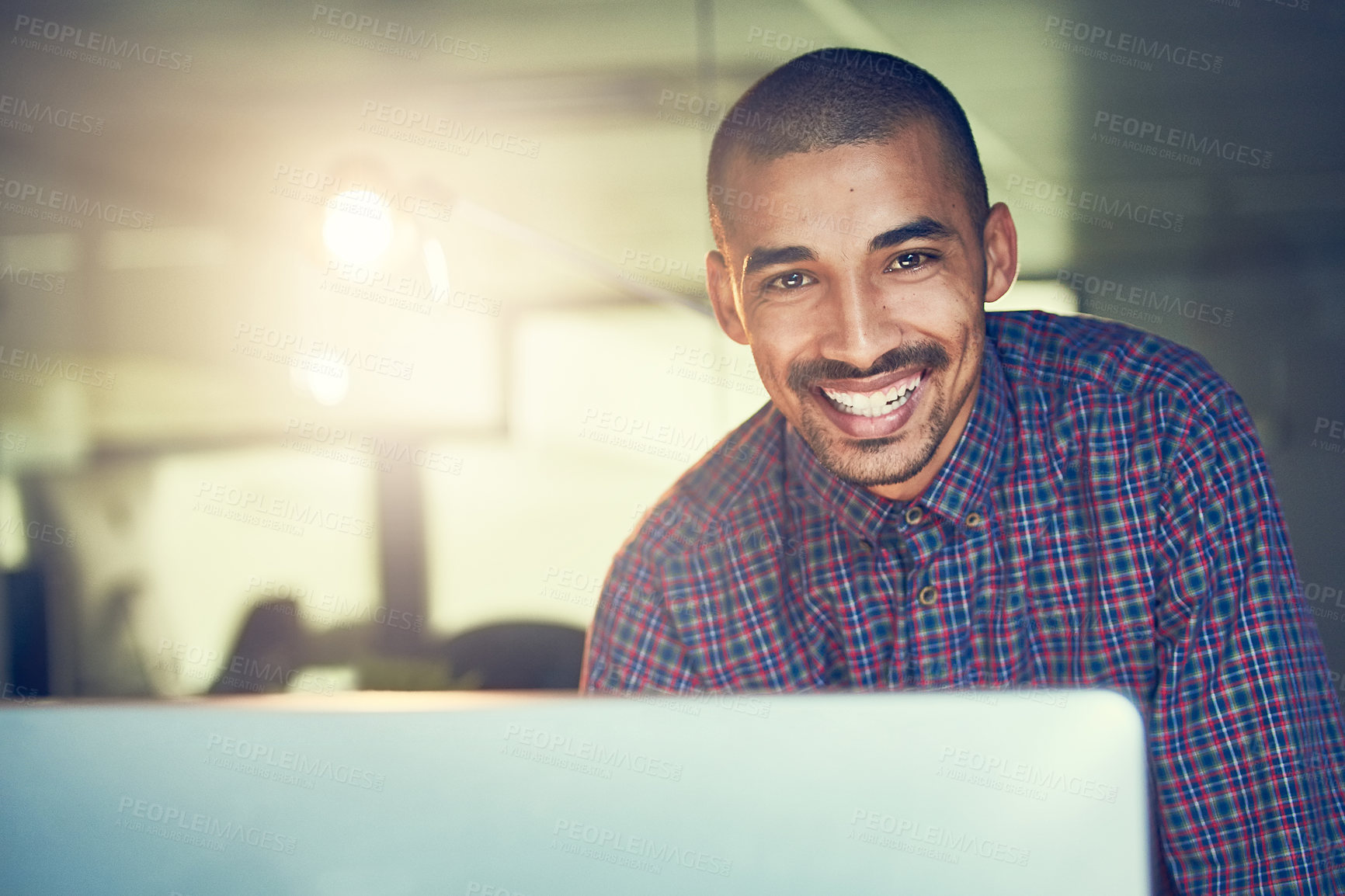 Buy stock photo Portrait of a young designer working late in an office