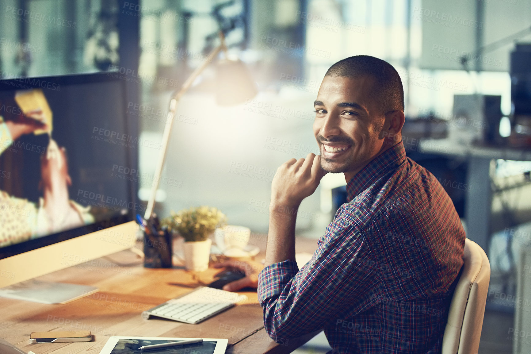 Buy stock photo Man, portrait and night at office with smile, software developer with programming deadline and computer at desk. IT, working late with productivity and company server upgrade with tech at startup