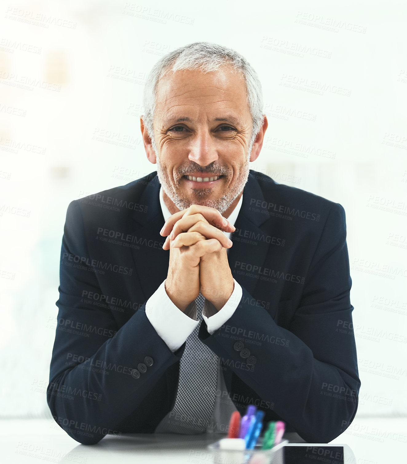 Buy stock photo Smile, portrait and senior man in office happy, confident and empowered on white background. Face, confidence and elderly male CEO cheerful at desk, proud and satisfied with his corporate career