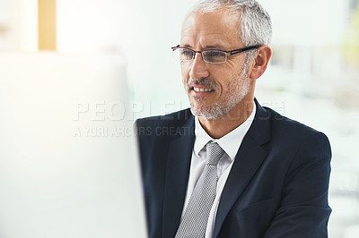 Buy stock photo Computer, smile and mature businessman in office with glasses for web, research and b2b communication. Pc, review and CEO reading company newsletter, planning or checking email, schedule or feedback