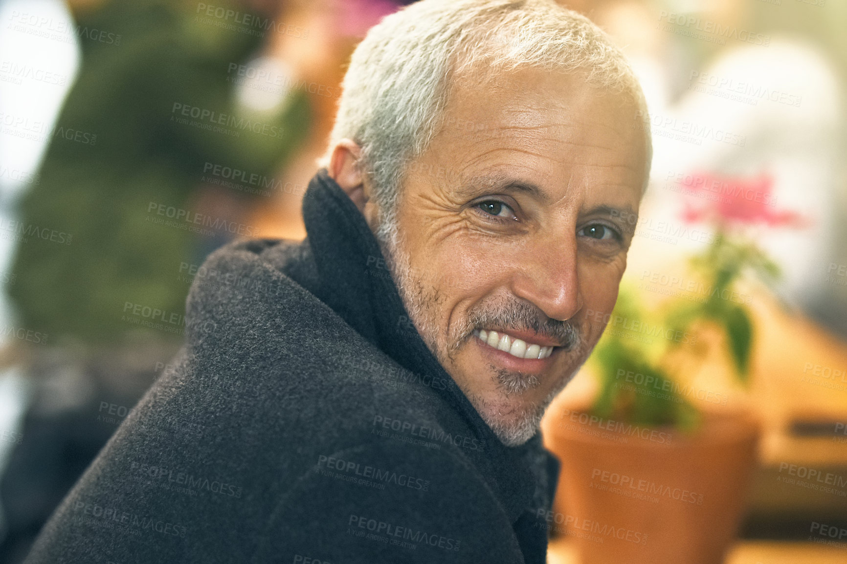 Buy stock photo Portrait of a mature man sitting inside a cafe