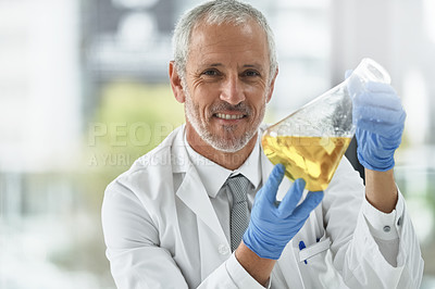 Buy stock photo Portrait of a researcher working with beakers in a lab