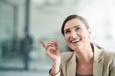 Buy stock photo Shot of a professional businesswoman looking inspired by a thought at work