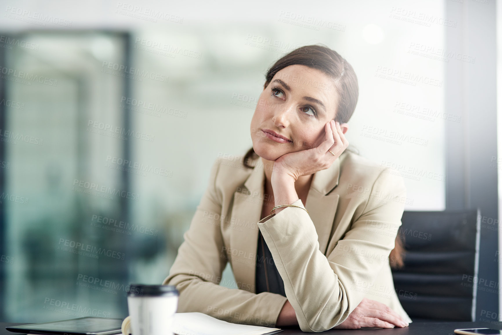 Buy stock photo Shot of a businesswoman looking bored at work