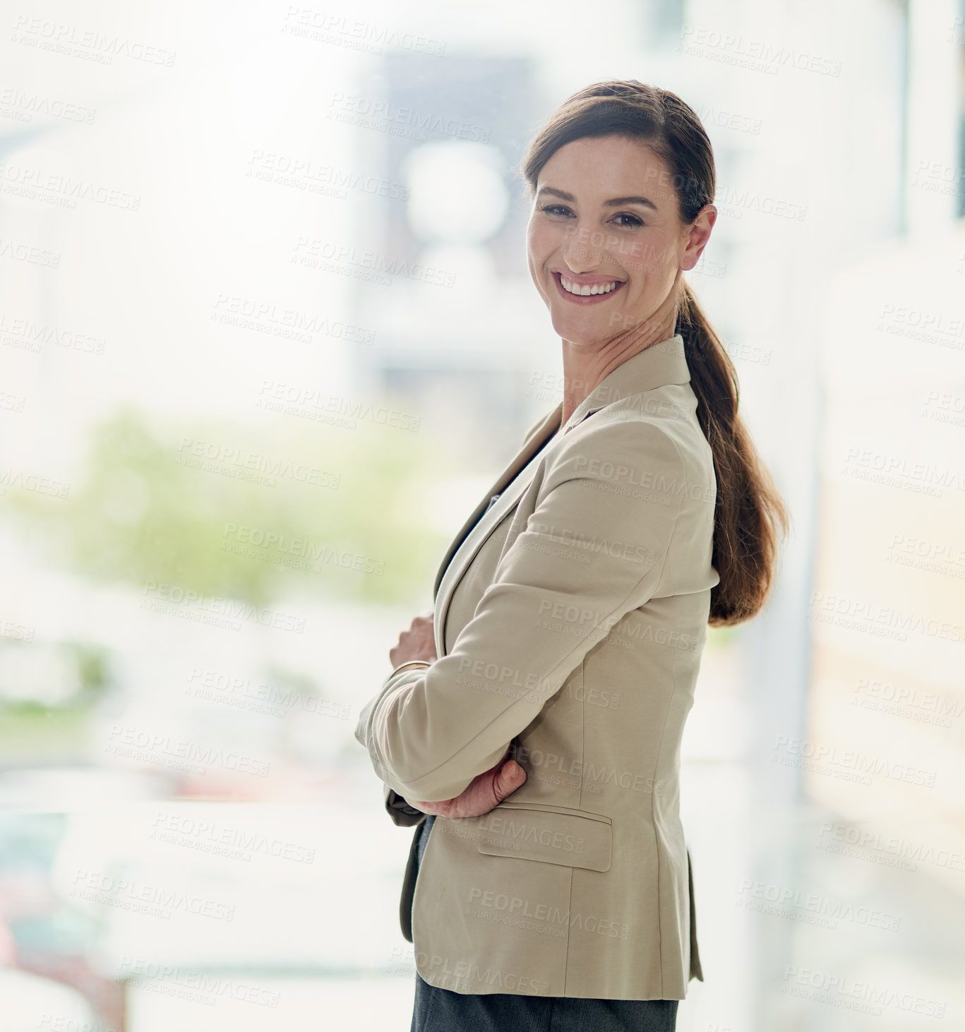 Buy stock photo Portrait of a happy and confident businesswoman working in a modern office