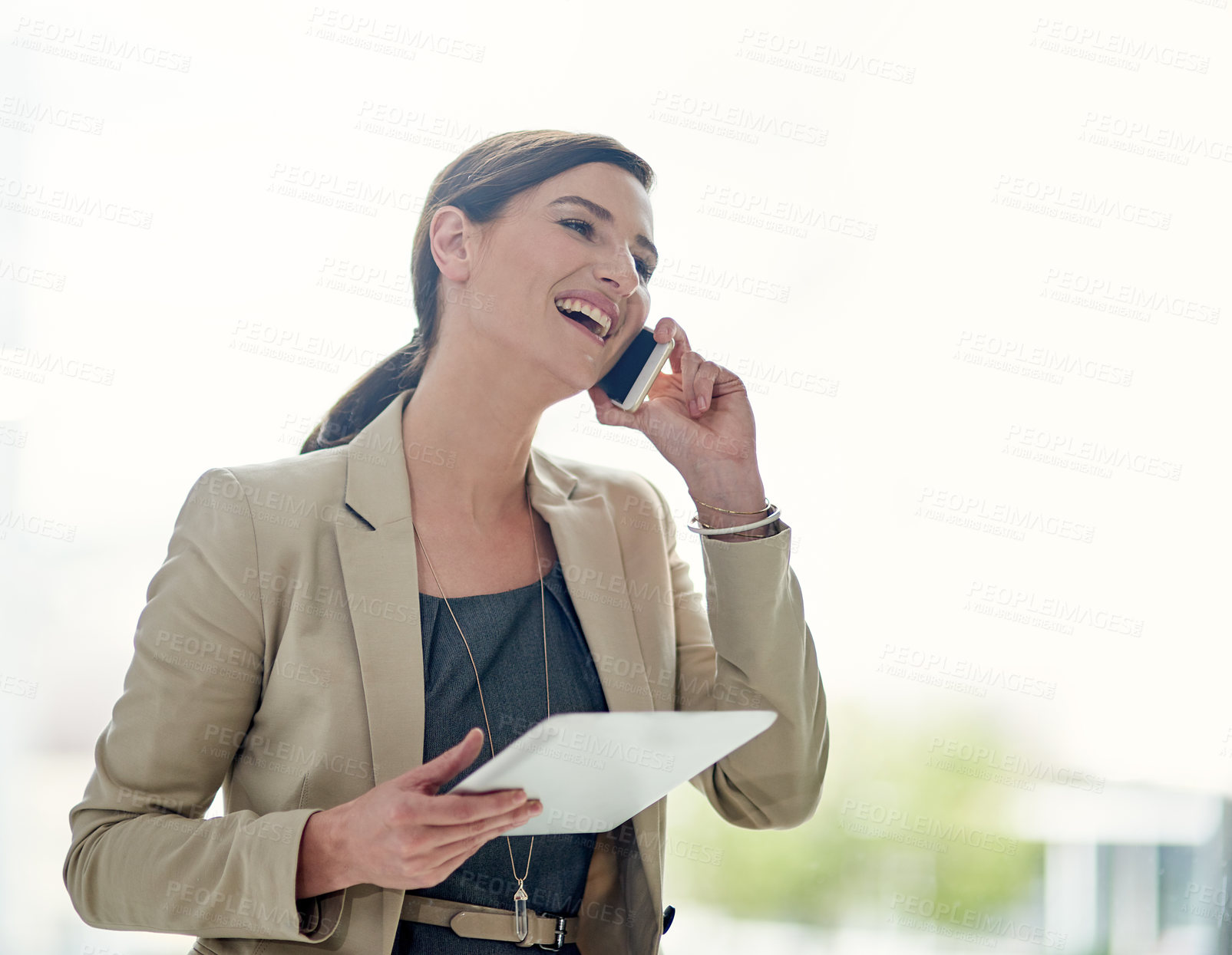 Buy stock photo Shot of a professional businesswoman using a phone and digital tablet at work