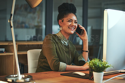 Buy stock photo Shot of an attractive young woman using her cellphone in the office