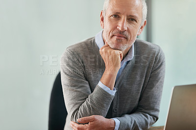 Buy stock photo Portrait of a mature businessman looking thoughtful while sitting in his office