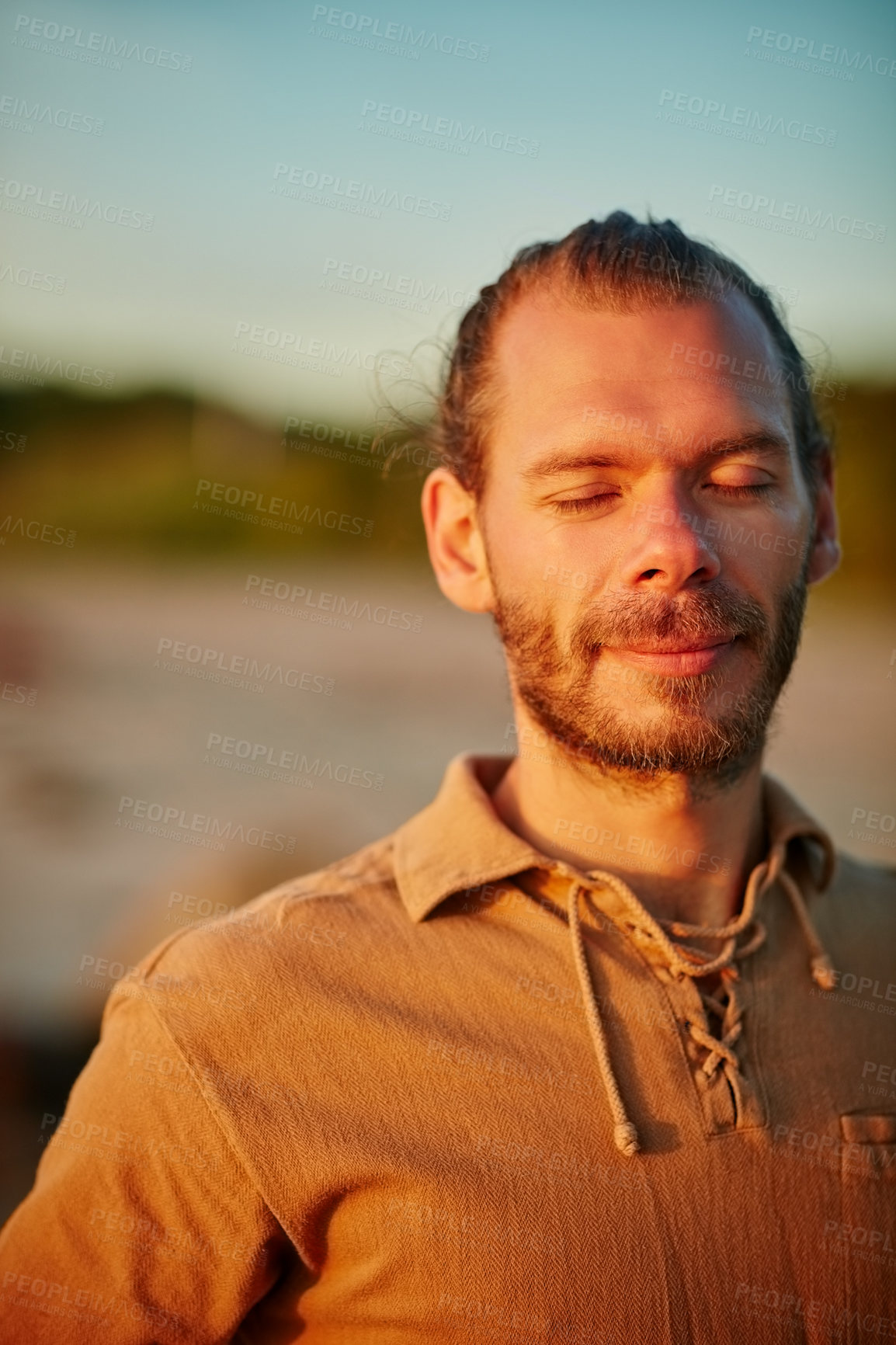 Buy stock photo Shot of a man enjoying a peaceful moment at the beach