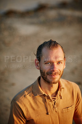 Buy stock photo Portrait of a man spending a relaxing day at the beach