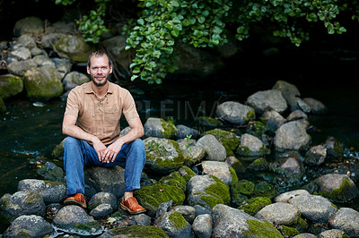 Buy stock photo Portrait of a handsome man sitting outdoors