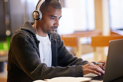 Buy stock photo Cropped shot of a college student working on a laptop at campus
