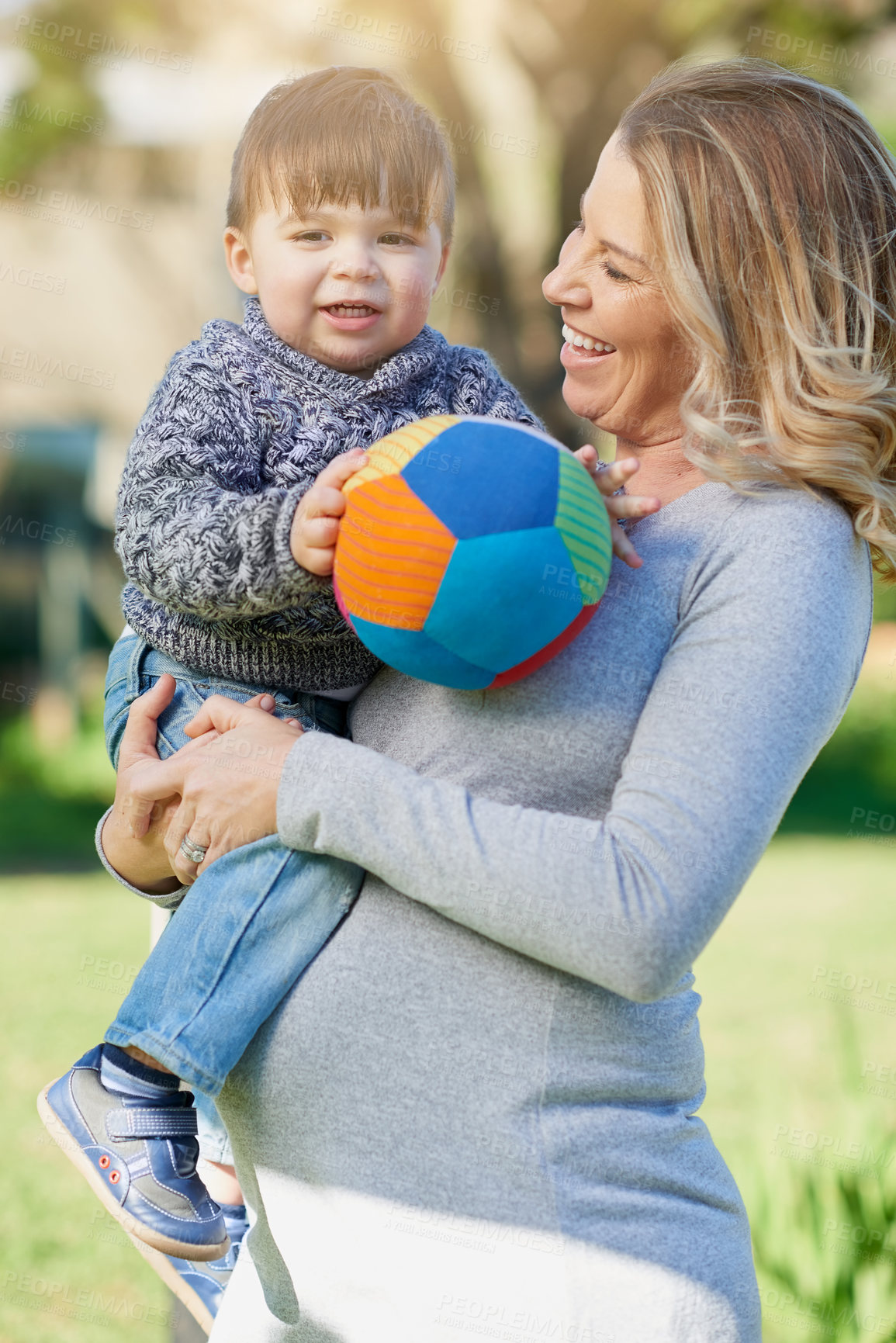 Buy stock photo Cropped shot of a mother bonding with her little boy outside