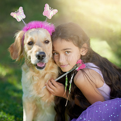 Buy stock photo Portrait of a cute little girl playing dress up with her dog outside