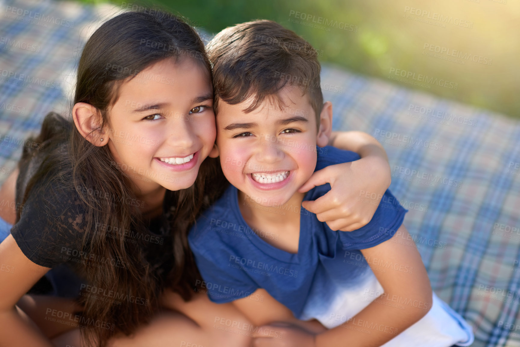 Buy stock photo Portrait, siblings and smile of kids, hug and family in picnic, outdoor and summer in weekend to relax. Backyard, happiness and boy with embrace from sister, together and girl with love for brother