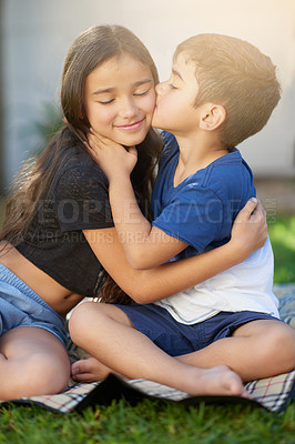 Buy stock photo Kids, boy and kiss for sister, hug and family in picnic, outdoor and summer in weekend to relax in park. Backyard, happiness and siblings with embrace, girl and brother with love together in morning