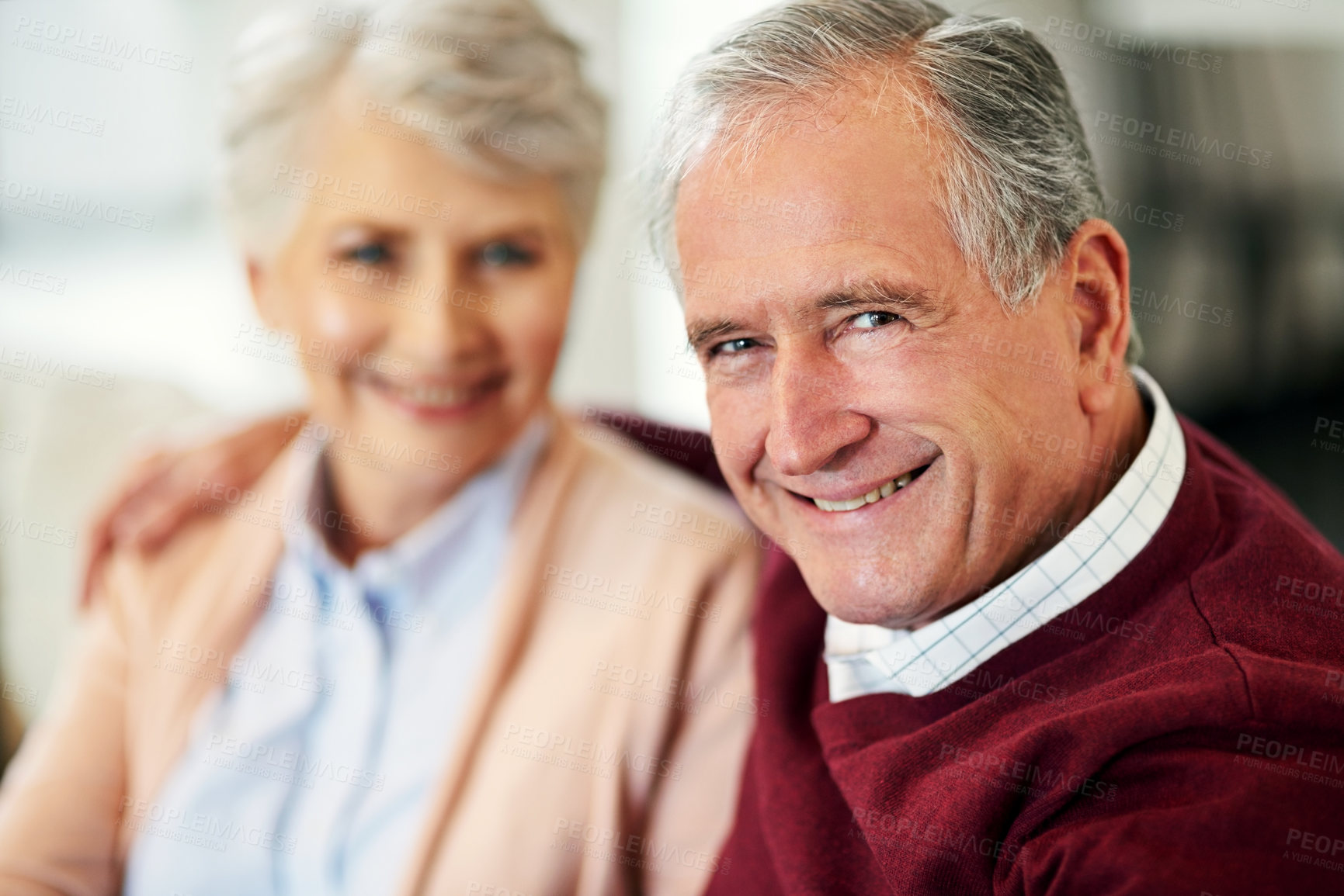 Buy stock photo Portrait of a senior couple sitting together at home