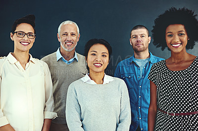 Buy stock photo Portrait of a diverse team of creative colleagues posing in the studio