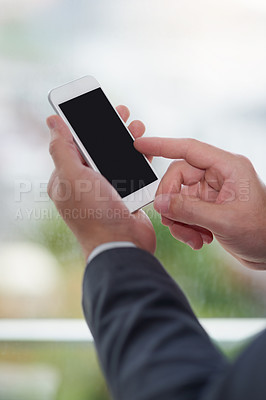 Buy stock photo Cropped shot of corporate businessmen texting on a cellphone