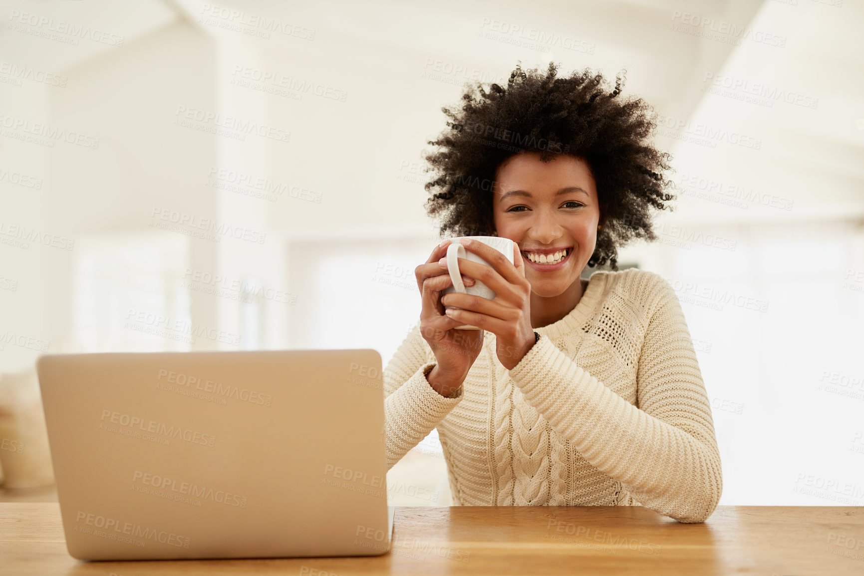 Buy stock photo Portrait of an attractive young using her laptop and drinking some coffee at home
