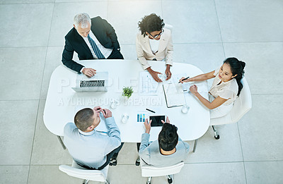 Buy stock photo Meeting, top view and team of business people in discussion, planning or financial consultant brainstorming ideas. Above, group collaboration and conversation on laptop for project strategy in office