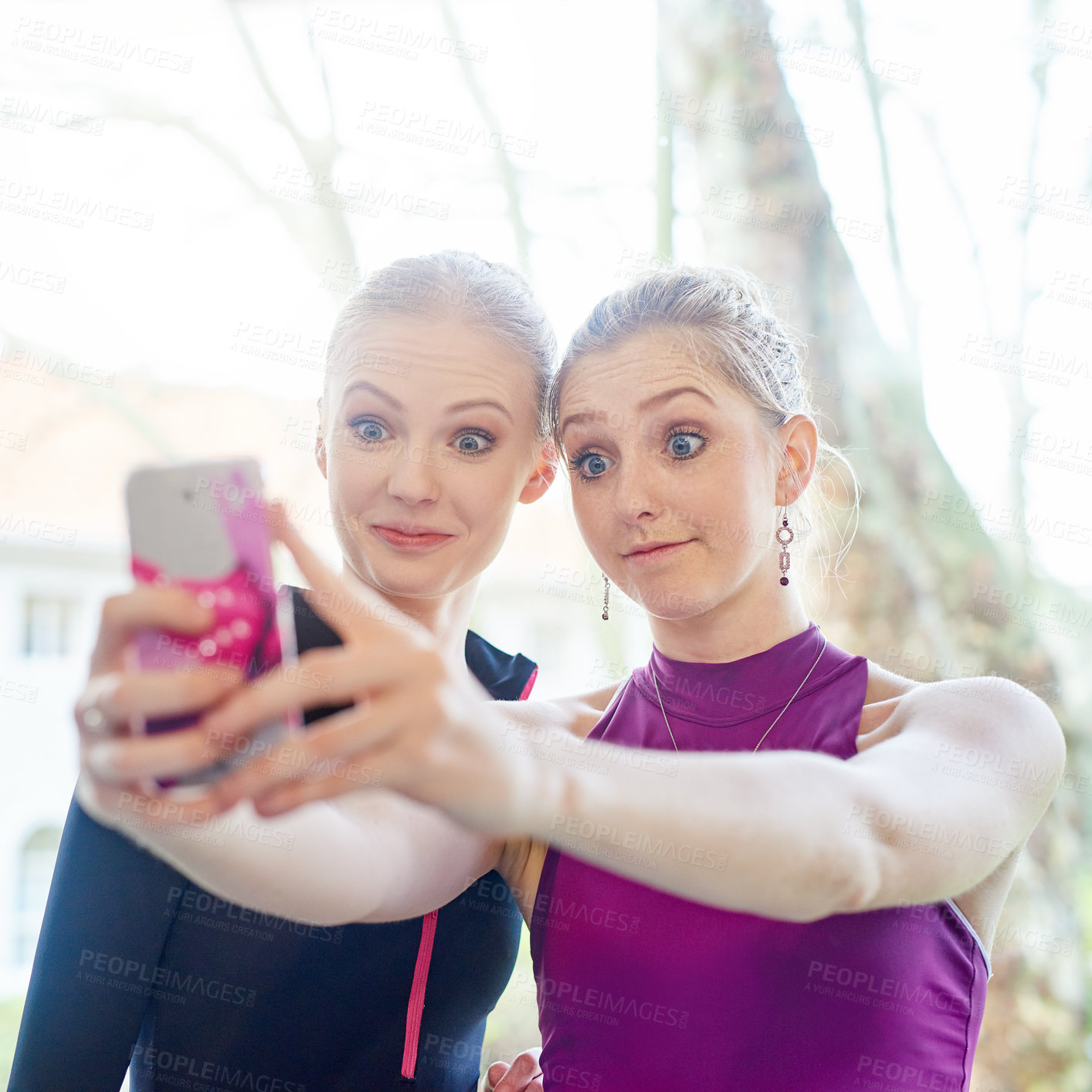 Buy stock photo Cropped shot of two sporty young women taking a selfie after their workout