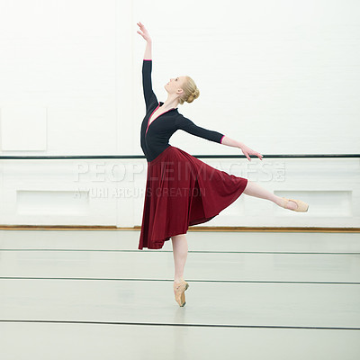 Buy stock photo Shot of a young woman practising ballet