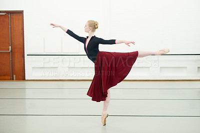 Buy stock photo Shot of a young woman practising ballet