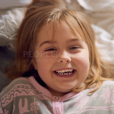 Buy stock photo Portrait, girl and happiness in house for relax, laughing and comedy in bedroom for weekend. Female child, smile and excited in family home for vacation, break and morning for rest and development 