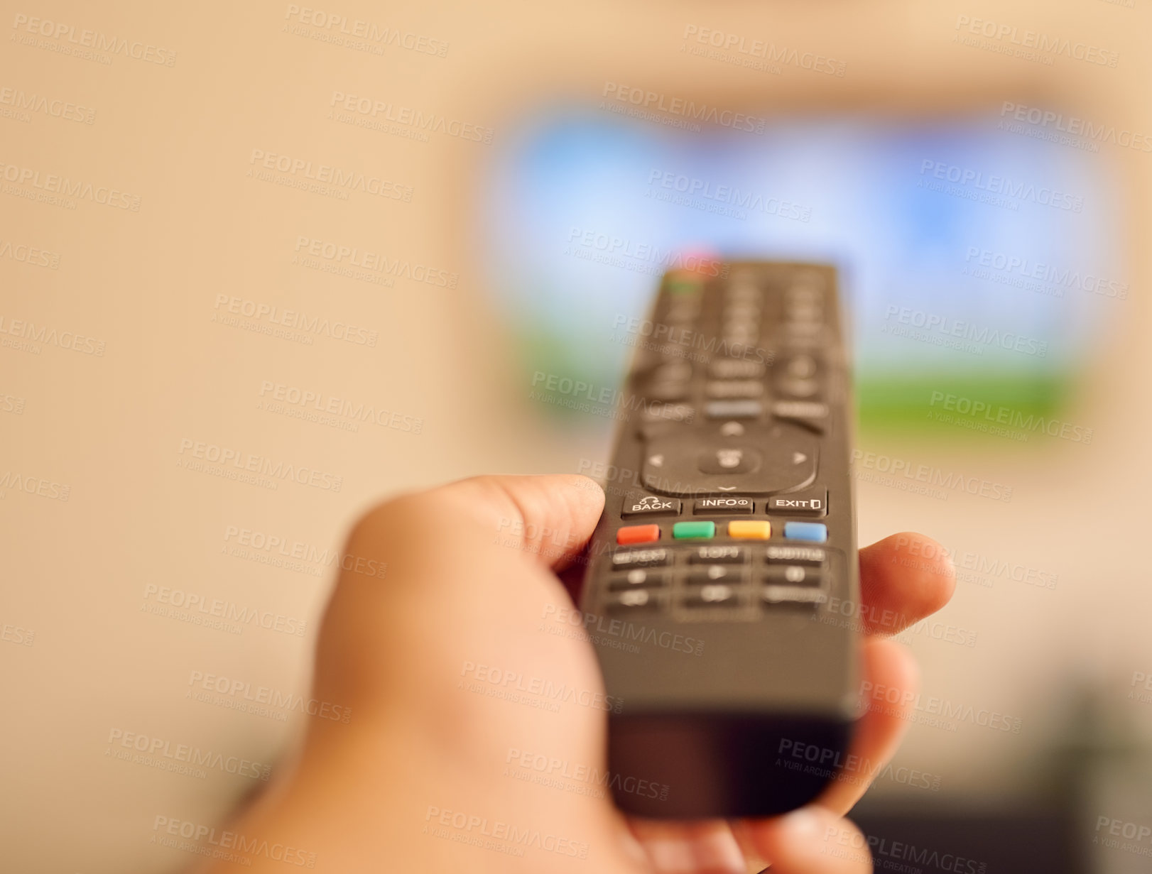 Buy stock photo POV shot of a person aiming a remote control at a flat screen television