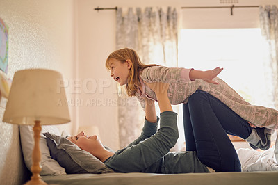 Buy stock photo Shot of a mother and her little girl playing together in the bedroom