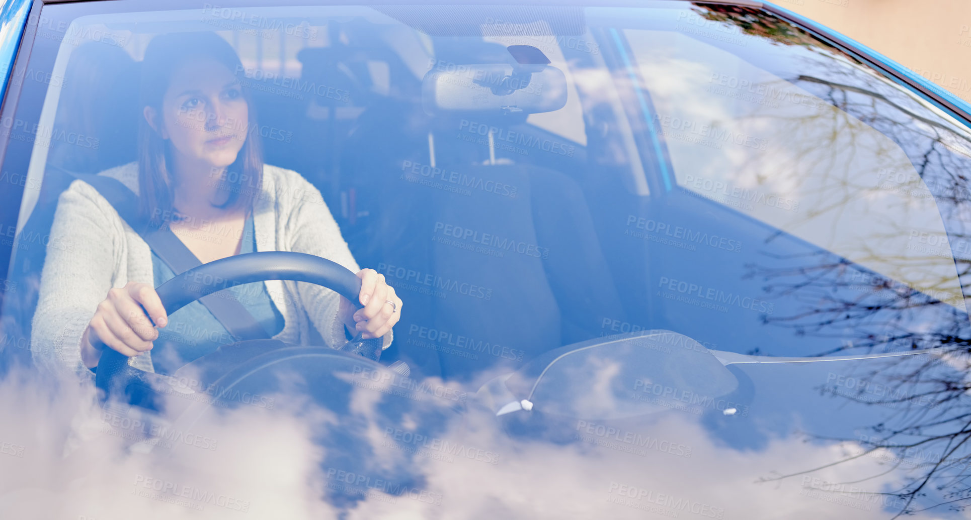 Buy stock photo Woman, driving and thinking in car for travel, journey and transport in countryside. Female person, reflection and looking out windshield in vehicle for idea, contemplate and memories on road