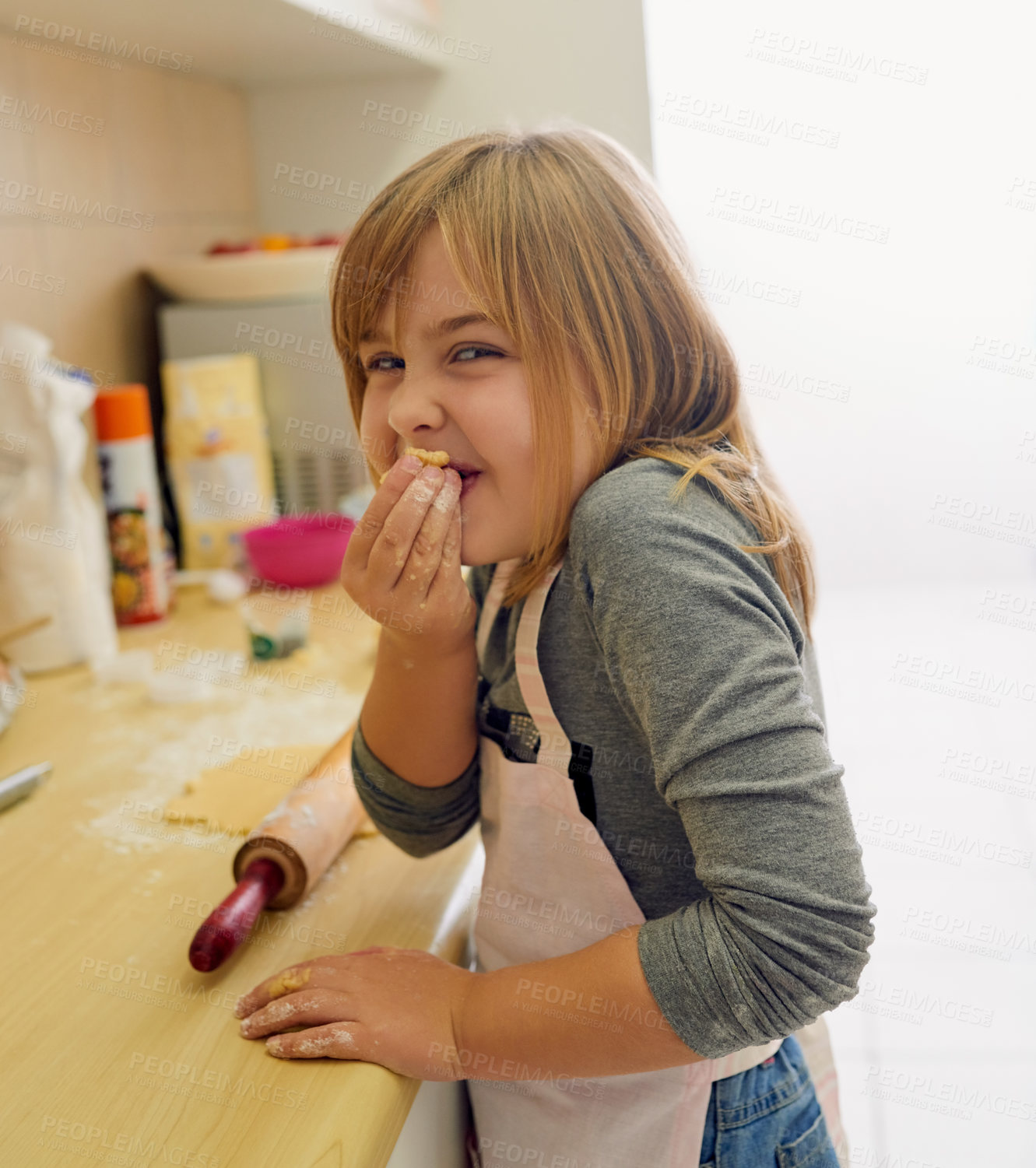 Buy stock photo Happy, young girl and learning to cook in portrait with dough and rolling pin for lesson in kitchen. Excited, food and chef baking cookies at home for child development and cooking education