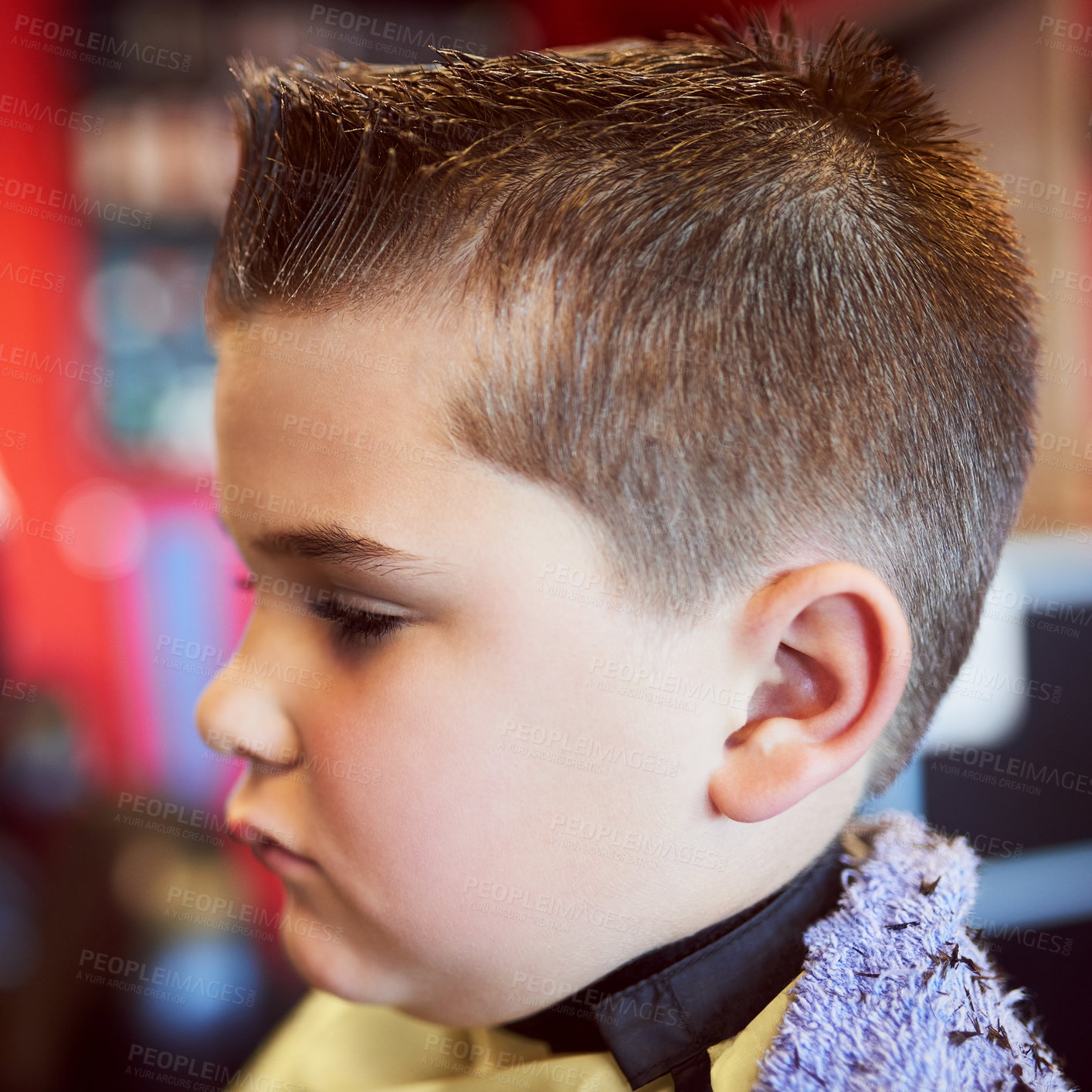 Buy stock photo Closeup shot of a young boy getting a haircut at a barber shop