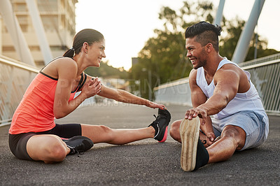 Buy stock photo Smile, exercise and couple stretch on bridge for health, wellness or warmup for run. Man, woman and training on road for cardio, preparation and fitness together in city for marathon, jog or sprint