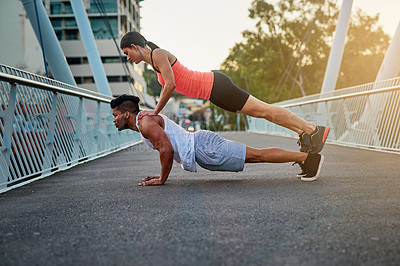 Buy stock photo Couple, bridge and balance on back for fitness or daily exercise for training, pushup and workout partner for health. Man, girl and together outdoor for bonding for wellness or wellbeing and cardio.