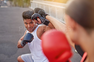 Buy stock photo Kickboxing, fight and people training in city for fitness, workout or martial arts man on street for body health. Combat sport, gloves and coach outdoor on road for exercise, wellness and challenge