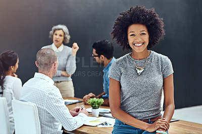 Buy stock photo Portrait of a businesswoman standing in the boardroom while a colleague gives a presentation in the background