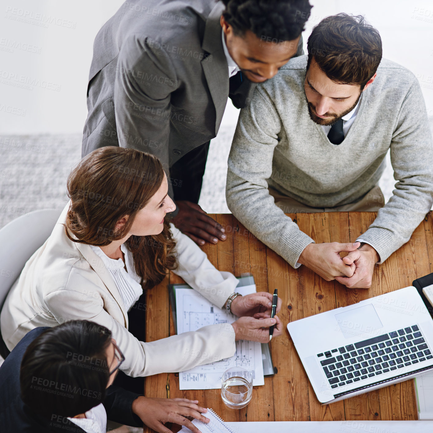 Buy stock photo High angle shot of a group of businesspeople having a meeting in an office